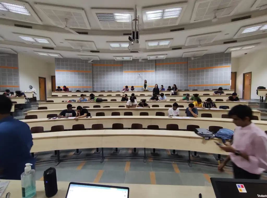 Person writing on blackboard